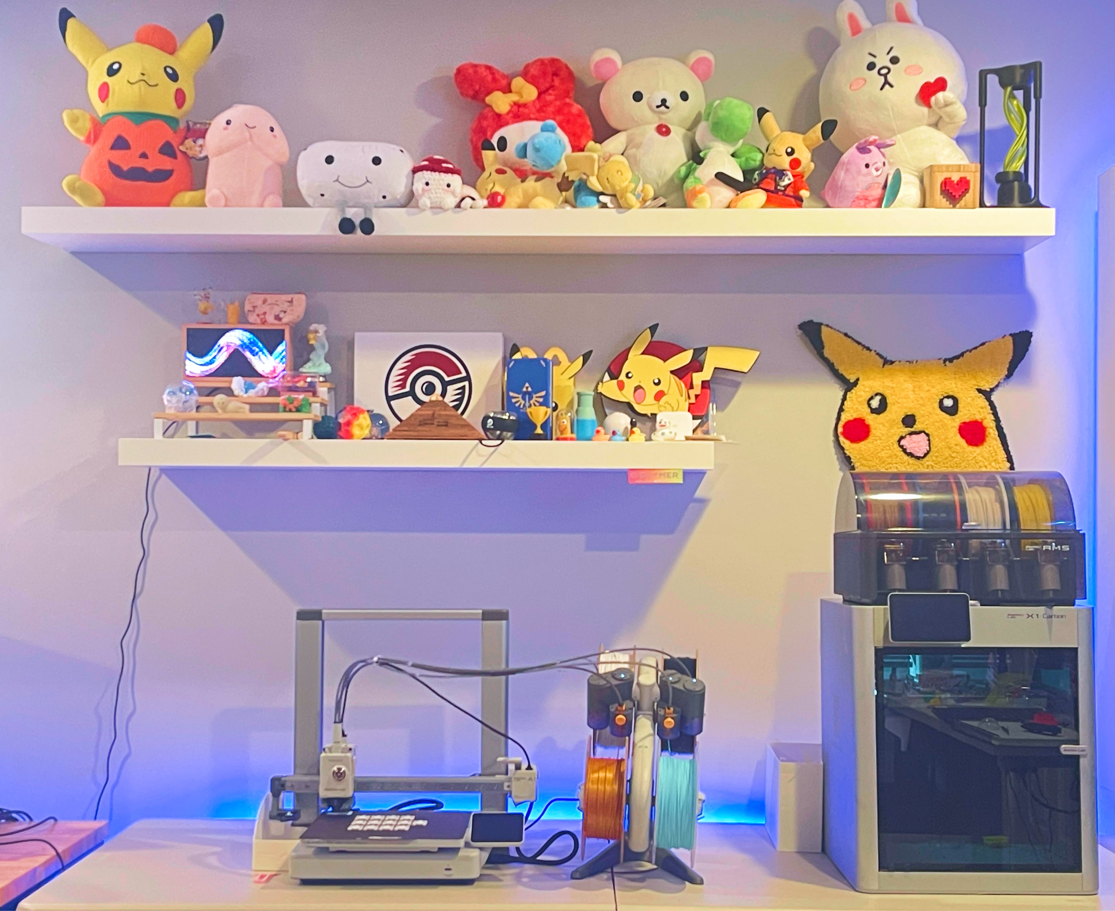 Creative workstation with 3D printer, colorful plush toys, and a playful atmosphere reflecting a passion for creativity and custom 3D printing