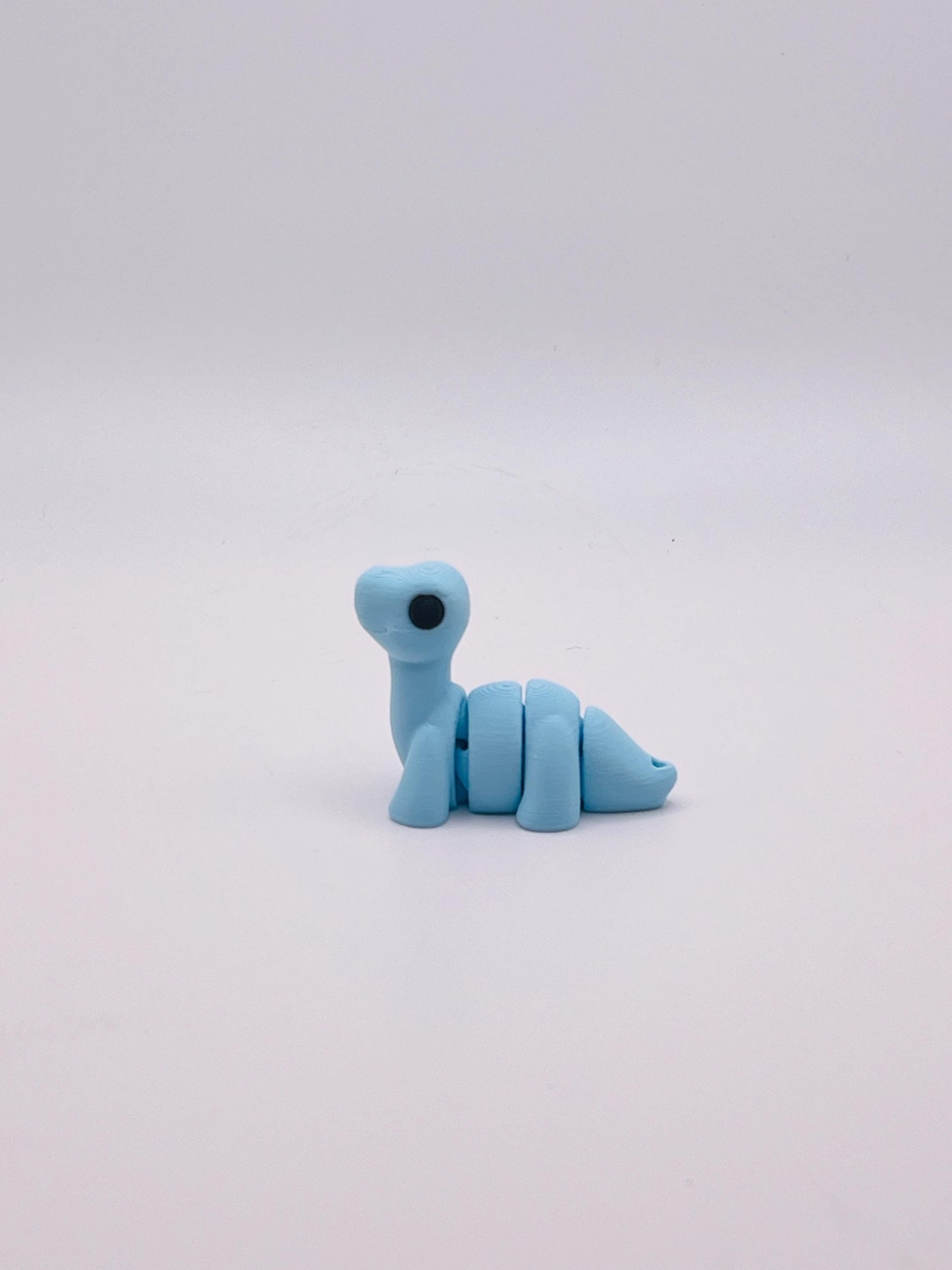 Cotton Candy Blue Brontosaurus Keychain – Sweet and Stylish Dino Accessory