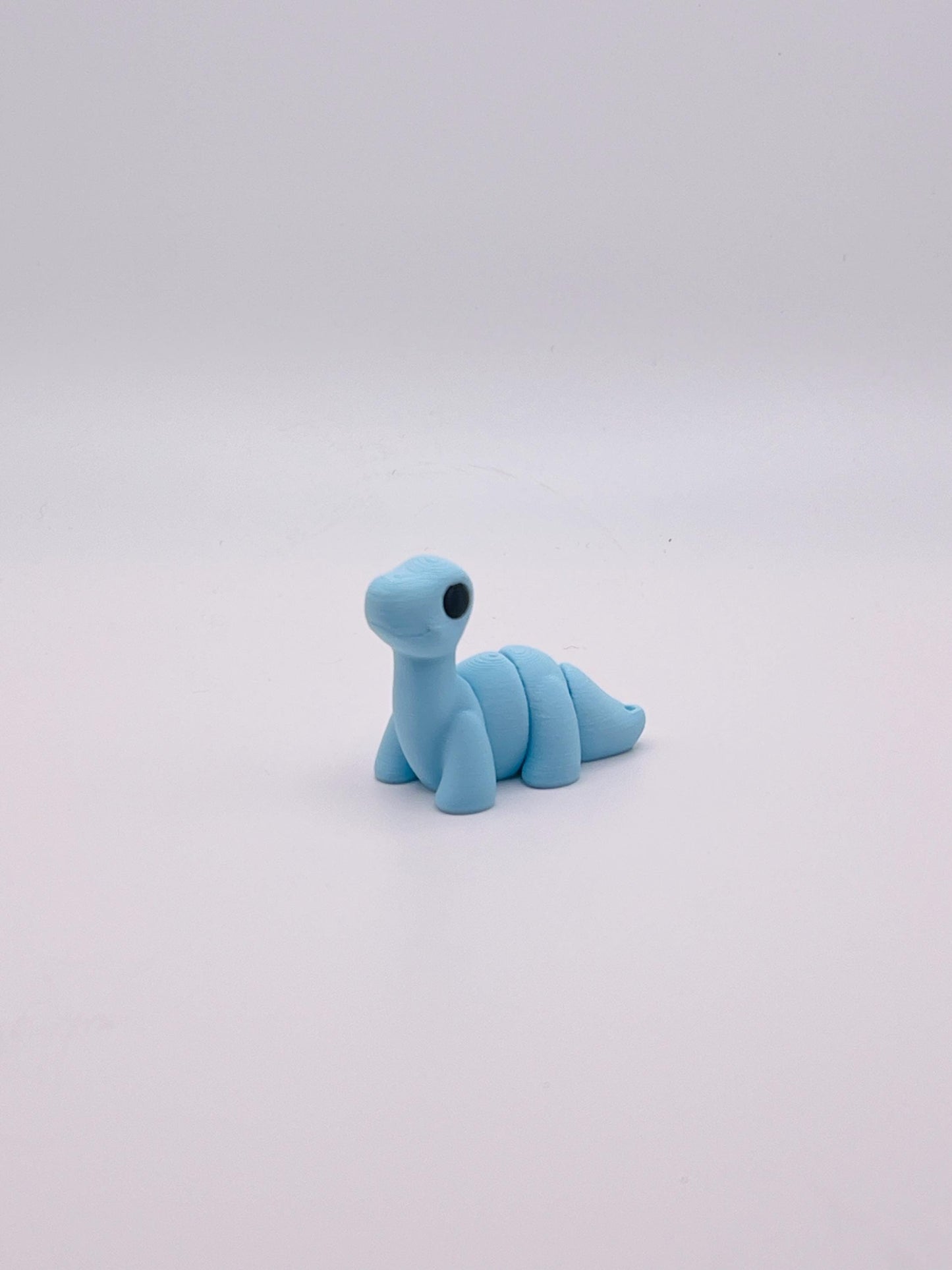 Cotton Candy Blue Brontosaurus Keychain – Sweet and Stylish Dino Accessory