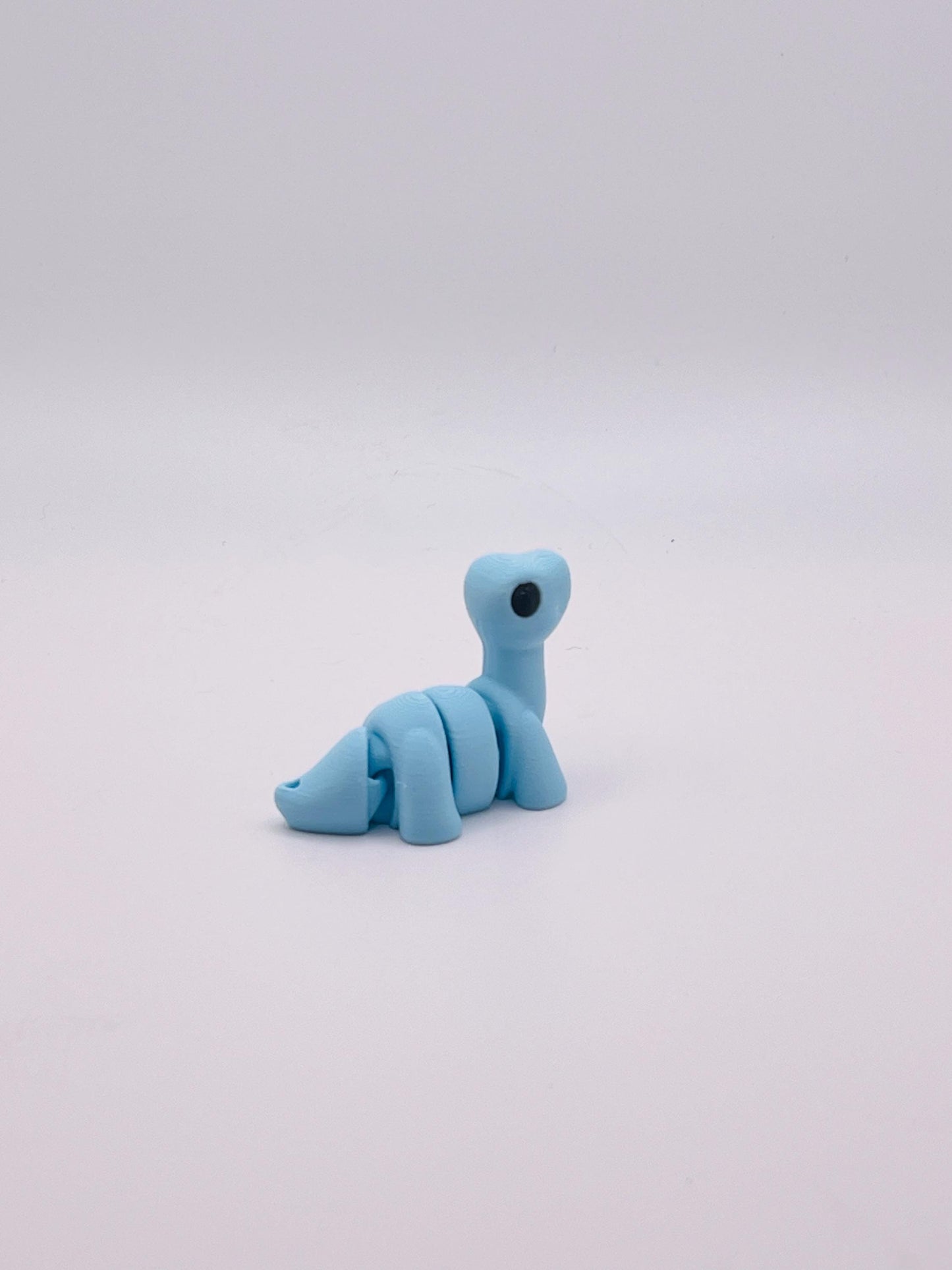 Cotton Candy Blue Brontosaurus Keychain – Sweet and Stylish Dino Accessory